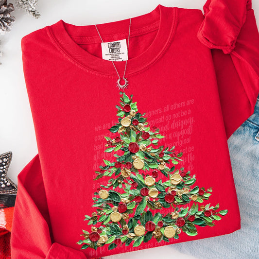 Red sweatshirt with a Christmas tree design on a white background