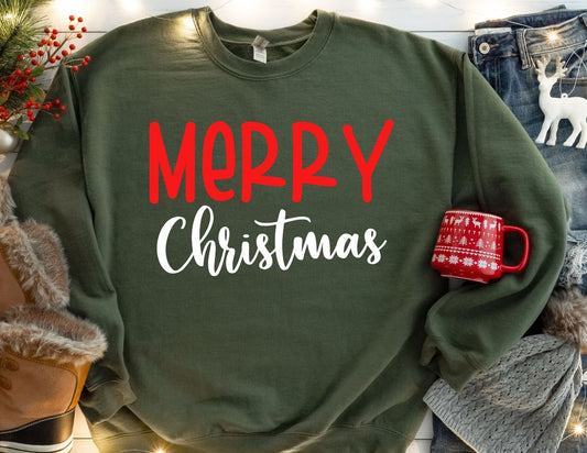 Green sweatshirt with 'Merry Christmas' text, red mug patch, and festive background.