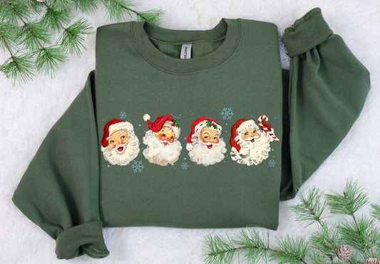 Green sweatshirt with Christmas-themed designs on a snowy background